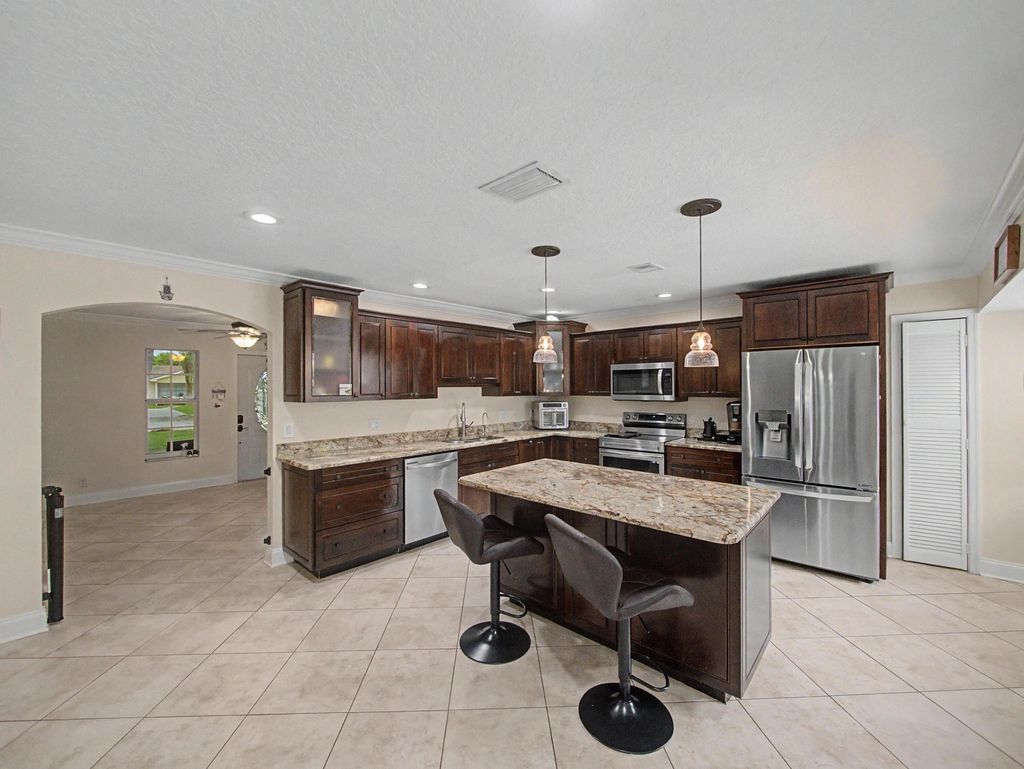 Photo of 4868 Canal Drive, Lake Worth, FL 33463 (MLS # B26034775)