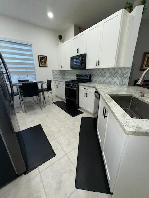 Photo of 125 Lancaster Way, Royal Palm Beach, FL 33414 (MLS # R11107304)