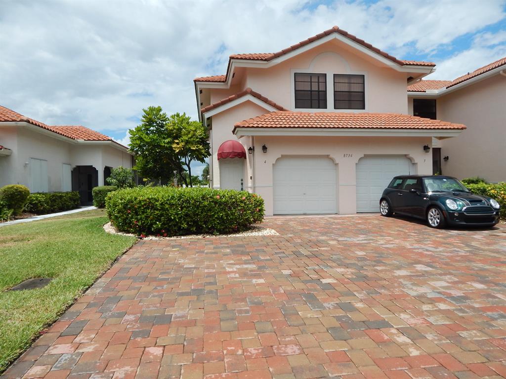 Located in the upscale gated community of Villa San Remo on a super quiet cul-da-sac street. This spacious, corner unit, 3 bedroom condo (2nd & 3rd bedroom diving wall has been removed but can easily be put back) has a very open floor plan + a bonus area off the kitchen perfect for a den or home office. On the ground level is a large 1 car garage. The huge screened porch overlooks a picturesque lake and amazing sunsets. Updated wood laminate floors thruout and central a/c is 3 years old. Community has a gorgeous lakefront pool, manned security gate, clubhouse, fitness center and tennis courts.