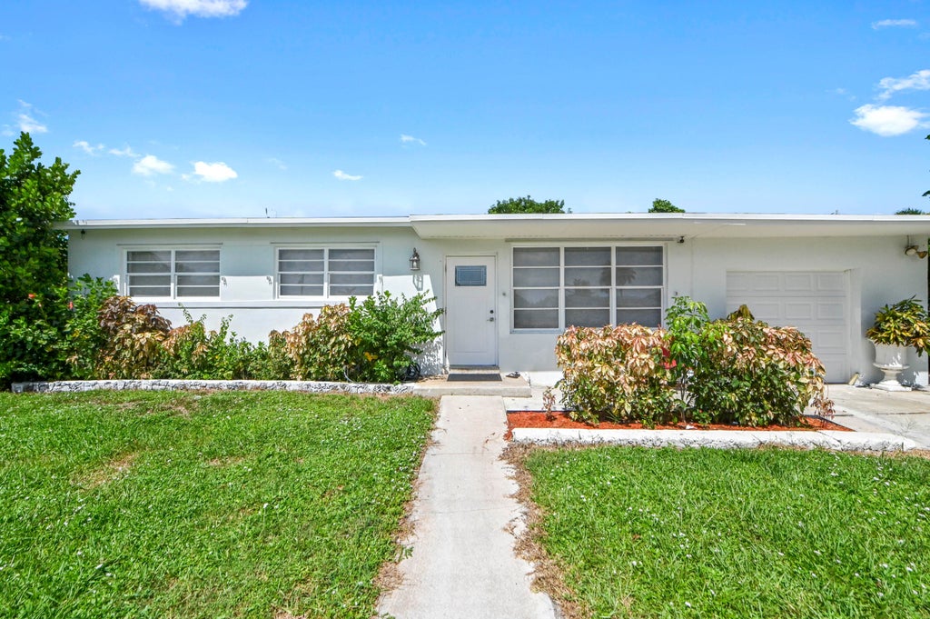 Photo of 149 Cayman Drive, Palm Springs, FL 33461 (MLS # B26069448)