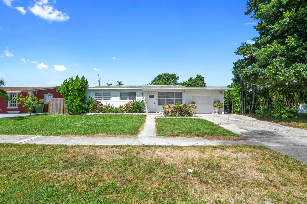 Photo of 149 Cayman Drive, Palm Springs, FL 33461 (MLS # B26069448)