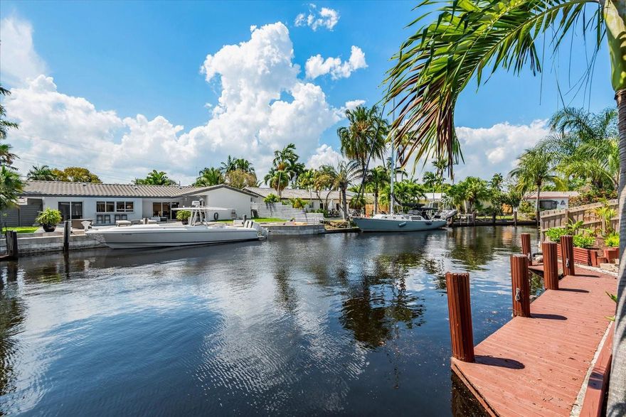 LOOKING FOR A WATERFRONT HOME IN SOUTHEAST FORT LAUDERDALE WITH DEEP WATER, OCEAN ACCESS AND NO FIXED BRIDGES WITH PROTECTED DOCKAGE FOR YOUR BOAT? THIS HOME IS TUCKED AWAY IN TROPICAL POINT LEADING TO THE NEW RIVER WATERWAY. FRESHLY PAINTED INSIDE AND OUT WITH TROPICAL LANDSCAPING. NEW DIAMOND BRITE SURFACING IN POOL, RENOVATED BATHROOMS AND FLOORS AND NEW SPRINKLER SYSTEM. WALK OR RIDE YOUR BIKE TO PARKS, DOWNTOWN RESTAURANTS AND BEACHES. STEP ONTO YOUR DOCK, HOP YOUR BOAT AND ENJOY SOUTH FLORIDA LIVING AT ITS BEST!