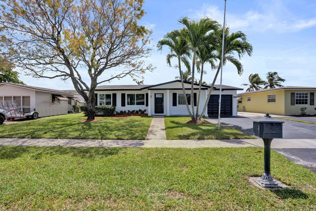 Photo of 9366 NW 23rd Street, Pembroke Pines, FL 33024 (MLS # B26013958)