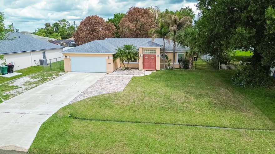 Freshly updated and ready to impress! This 3BR/2BA home with a 2-car garage offers peace of mind with a 2024 roof, 2024 A/C, 2024 ductwork, 2025 full impact glass windows, and a garage door replaced in 2025. Inside, enjoy tile flooring throughout and a sleek kitchen featuring quartz countertops and stainless steel appliances—perfect for everyday living and entertaining. Both bathrooms have been beautifully remodeled with contemporary finishes, while generous closet space keeps everything organized. Step outside to a fenced backyard with a covered, screened patio—ideal for relaxing or hosting—plus an oversized shed for a workshop, gym, or extra storage. Extended driveway provides ample space—perfect for a boat or RV. Set in a quiet, inviting neighborhood—schedule your showing today!
