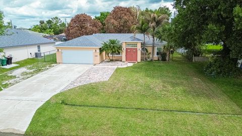 Photo of 1469 SW Leisure Lane, Port Saint Lucie, FL 34953 (MLS # B26019929)