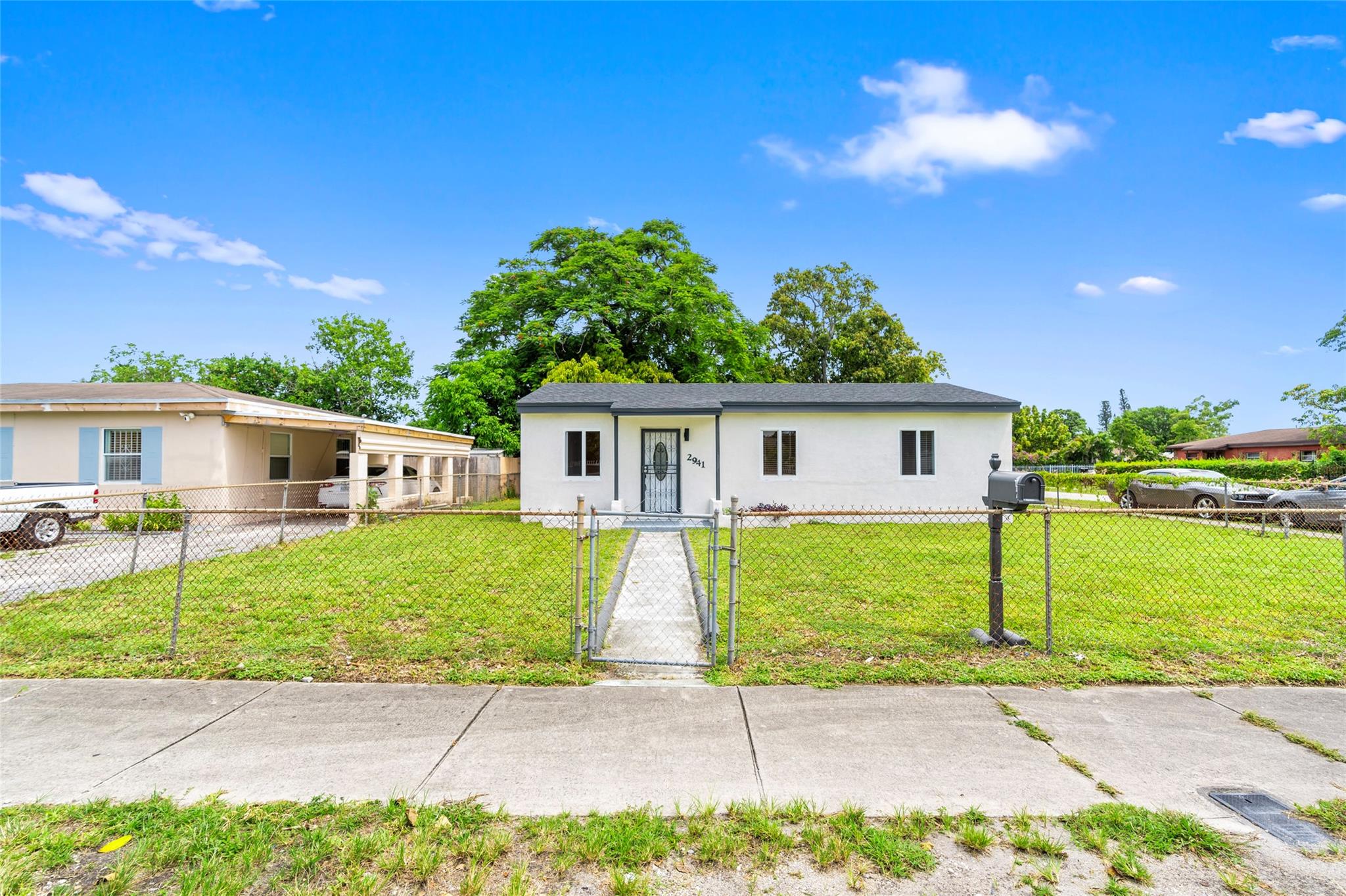 Move right in to this beautifully updated property featuring brand-new hurricane impact windows, new roof, stylish modern kitchen, and updated bathrooms. The home offers an open, airy layout with fresh flooring and plenty of natural light throughout. Enjoy peace of mind with upgraded finishes and enhanced storm protection. Large front and side yard provide great potential for outdoor living or expansion. Centrally located near major highways, schools, and shopping. Perfect for homeowners or investors — schedule your showing today!