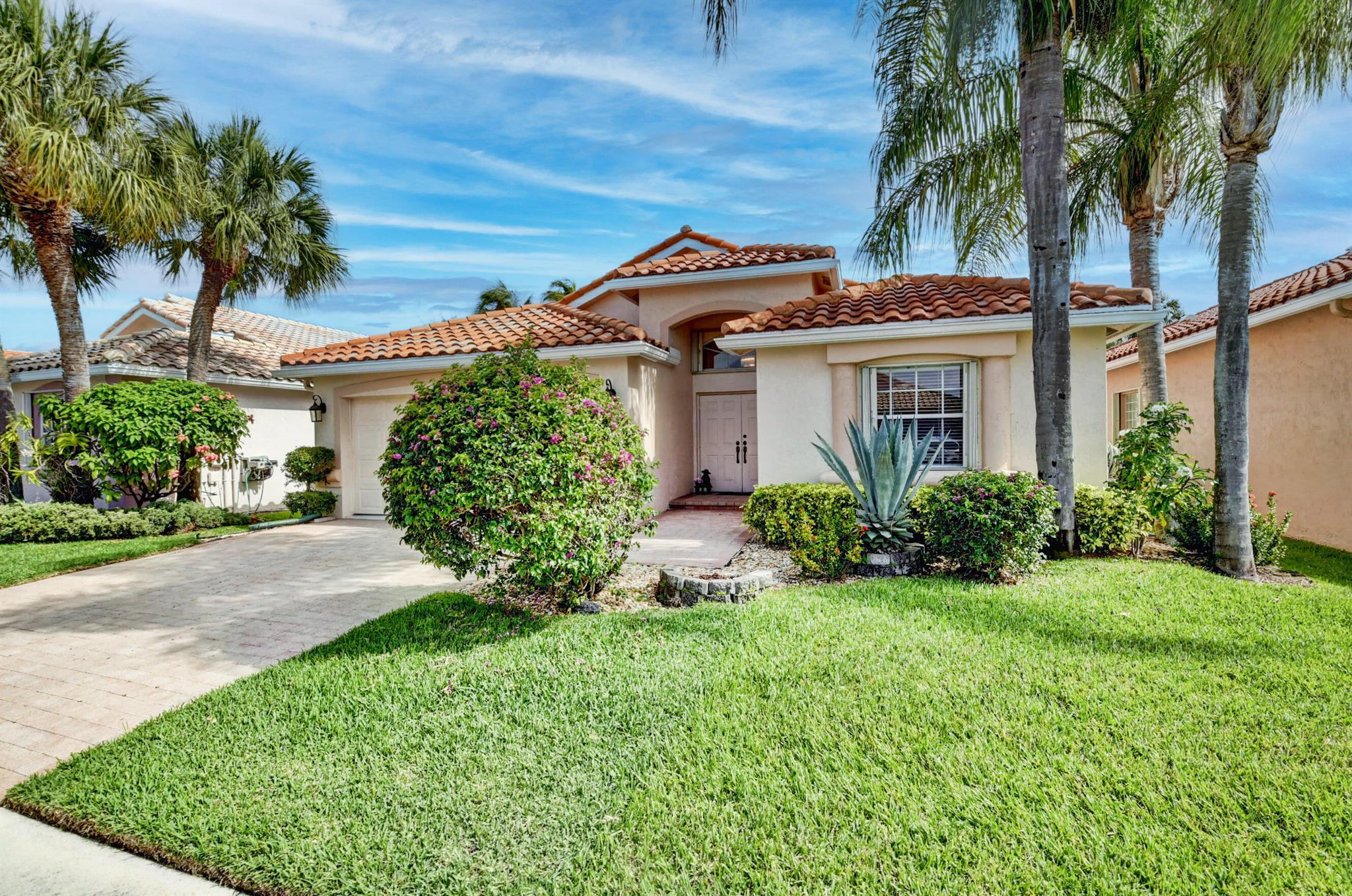 Seller offering a $5K credit towards granite/quartz countertops at closing. Fabulous 3 bedroom, 2 full baths with a 2-car garage. High ceilings, open, spacious & bright! Split bedroom plan offers you and your guests' privacy. Large eat in kitchen with up-dated stainless-steel appliances. Spacious primary suite with tons of closet space, dual sinks, luxurious soaking tub. Large covered screened patio with a private serene backyard. Accordion shutters. Well maintained home. ECM policy on all appliances, hot water heater and a/c, expires 4/24.