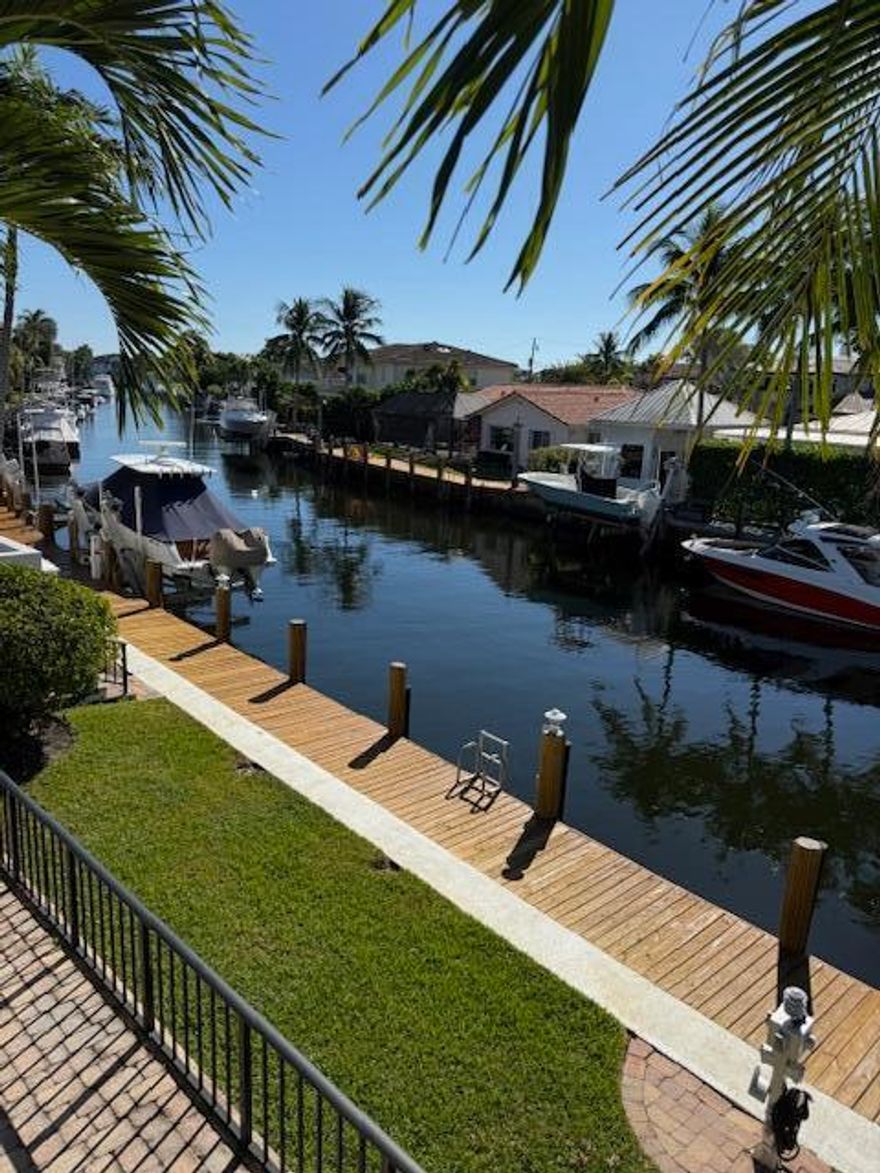 Stunning townhouse located on the intracoastal.  Located in a boating friendly community.  Property includes a private boat dock which accommodates up to 30' vessel. Townhouse was newly renovated, including brand new appliances, countertops, hard wood floors on staircase and much more! Absolutely beautiful and peaceful water views from the 1st floor deck off the living room as well from the master suite balcony upstairs.  Pets welcome 15 lbs and under. Don't miss out on this gem of a property!