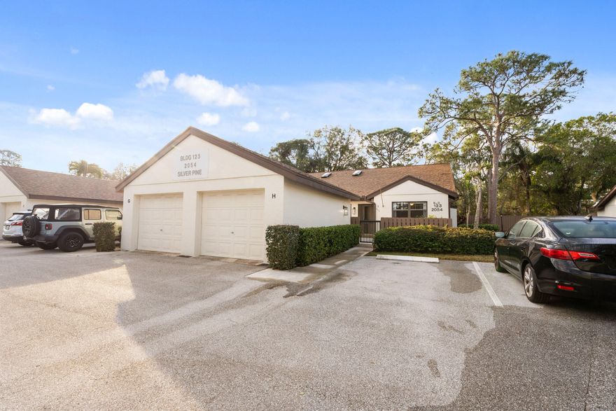 Highly desirable one-story villa-style end unit featuring 3 bedrooms, 2 full bathrooms, and a one-car garage. This home offers both front and back patios perfect for relaxing and enjoying the Florida lifestyle, along with new kitchen appliances.  Laundry hook up available inside unit. The maintenance fee covers exterior, including a 2022 roof, lawn care, and cable, providing truly low-maintenance living. The gated and private community features a heated pool, jacuzzi, tennis, pickleball, and bocce ball. A fantastic opportunity to own a peaceful, low-maintenance home in a prime Palm City location.