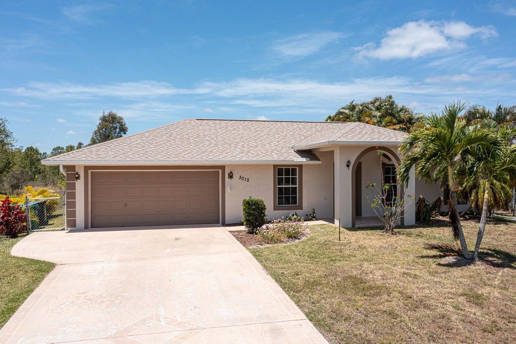 Photo of 3012 SE Wake Road, Port Saint Lucie, FL 34984 (MLS # R10980491)