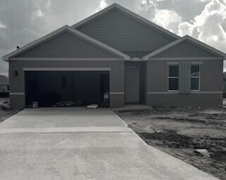 Photo of 912 NW Cairo Avenue, Port Saint Lucie, FL 34953 (MLS # R11001112)