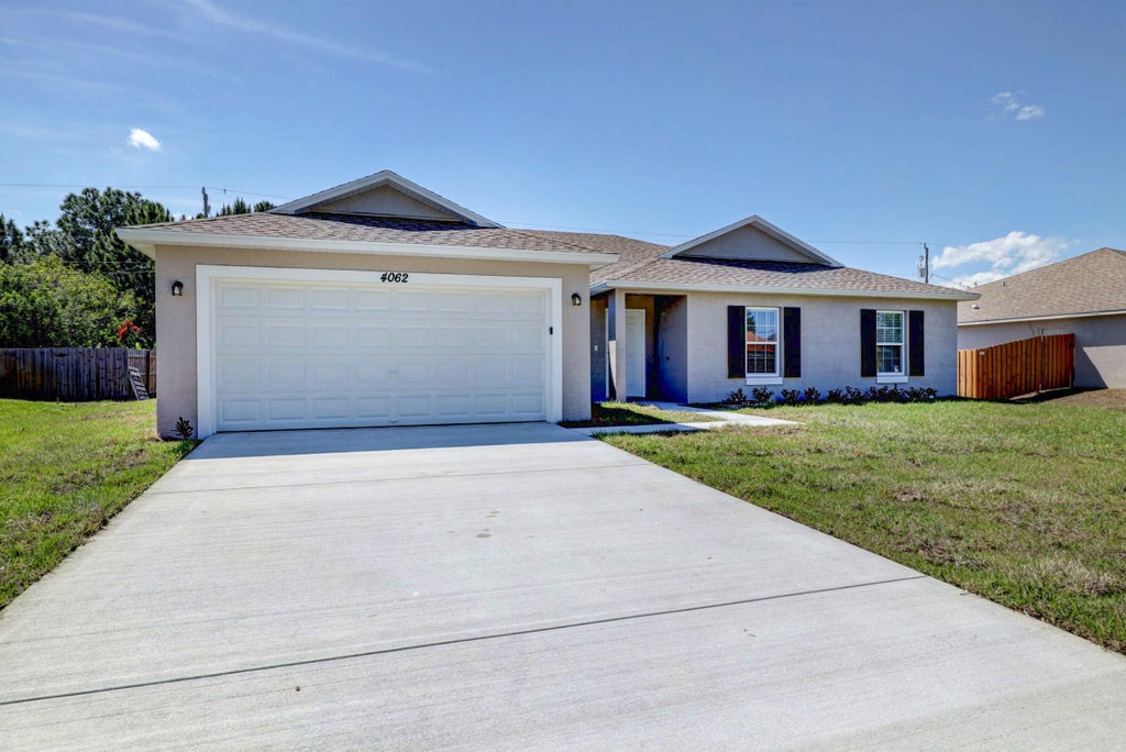 Photo of 449 SE Whitmore Drive, Port Saint Lucie, FL 34984 (MLS # R10955265)