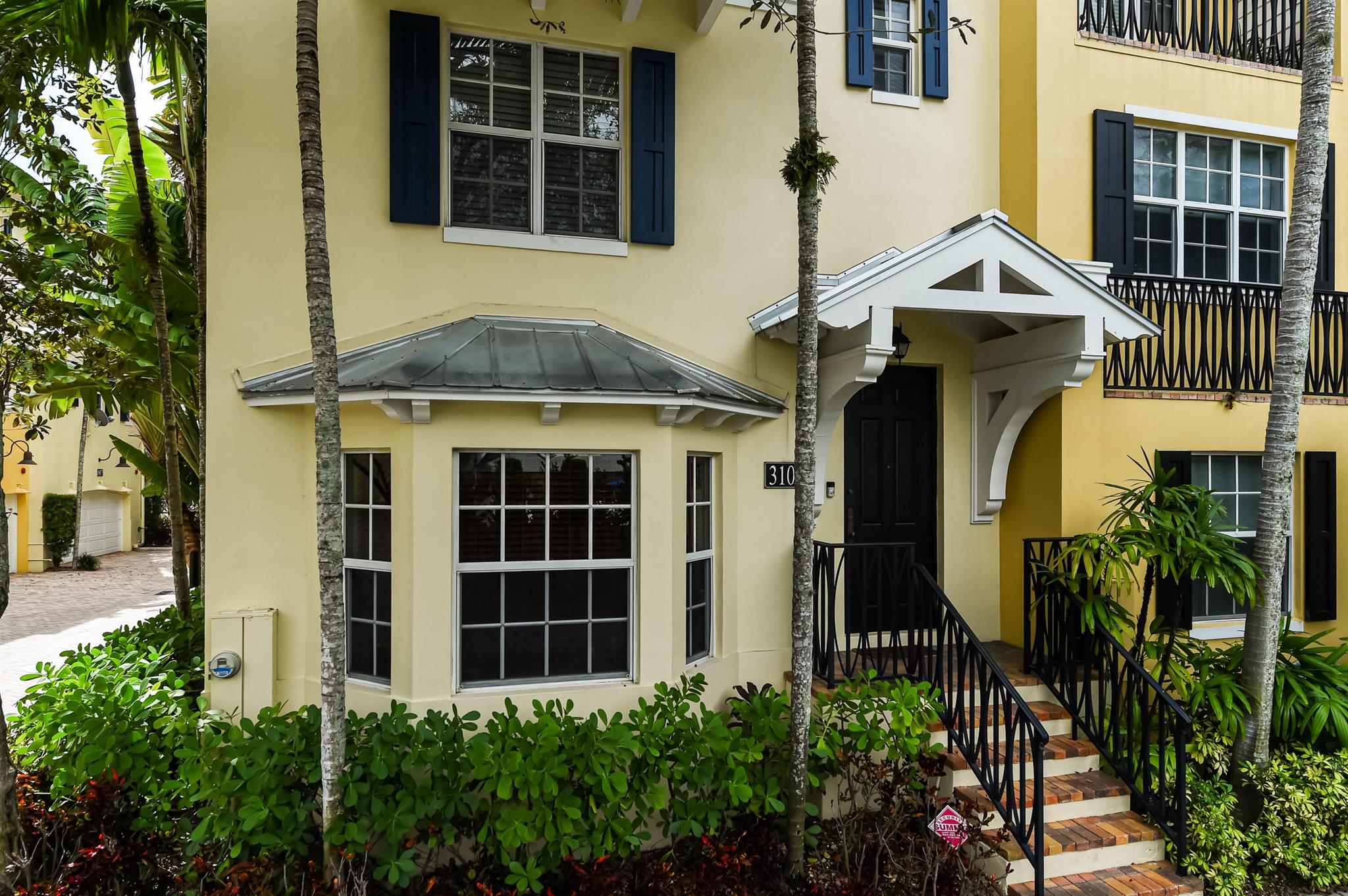 Nestled in the El Cid neighborhood, this beautifully renovated townhouse is one block from the Intracoastal. This 3 bedroom, 3.5 bathroom has been freshly updated with new faucets and light fixtures. The interior has fresh paint, an open layout, natural light and new carpet. The kitchen is equipped with stainless steel appliances and a large pantry. The first floor features a built-in Murphy bed, offering flexible space. The spacious primary suite features vaulted ceilings, a walk-in closet, and an on-suite bathroom with a separate shower and tub. Dual vanities and sinks add a touch of luxury and convenience. The additional bedrooms also include on-suite bathrooms. There is a 2-car garage and dedicated laundry area. Community amenities include a pool and grill area.