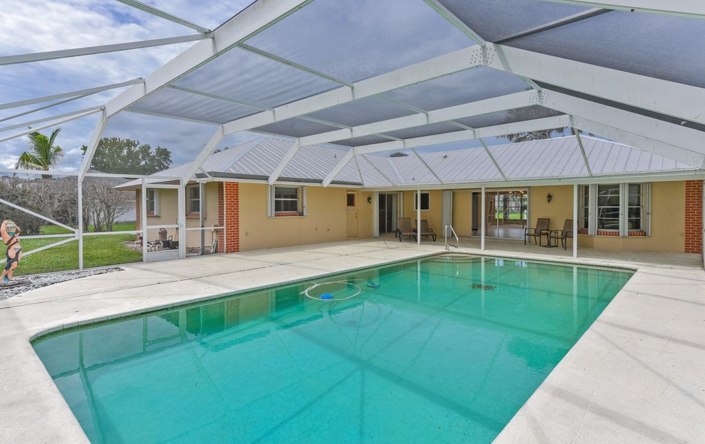 Photo of 1934 SE TICKRIDGE Road, Port Saint Lucie, FL 34952 (MLS # B26074023)