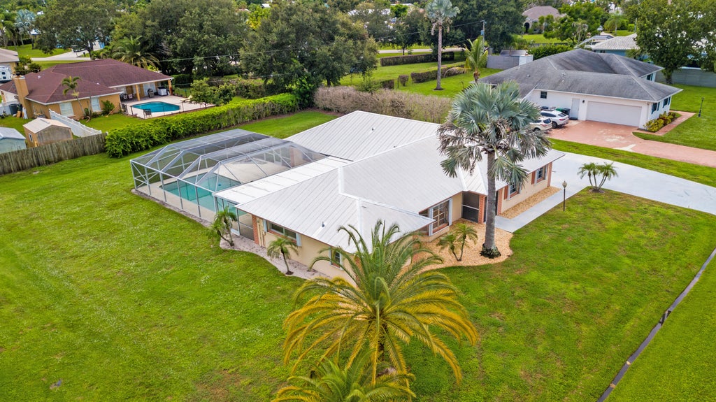Photo of 1934 SE TICKRIDGE Road, Port Saint Lucie, FL 34952 (MLS # B26074023)