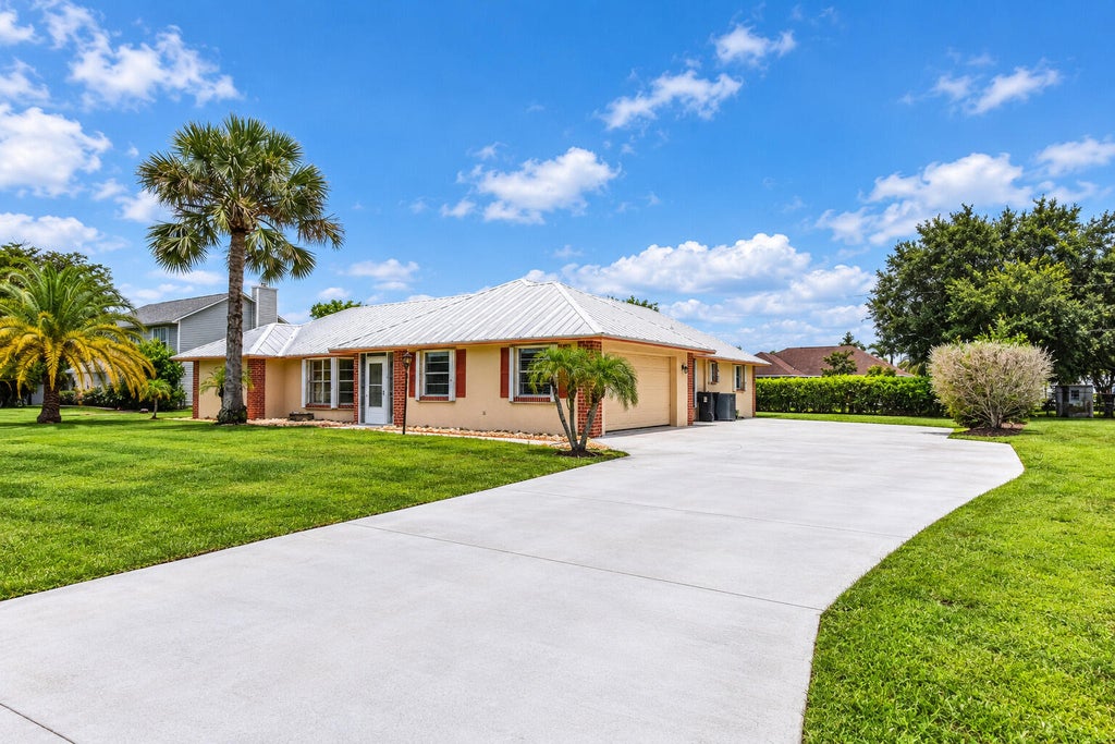 Photo of 1934 SE TICKRIDGE Road, Port Saint Lucie, FL 34952 (MLS # B26074023)