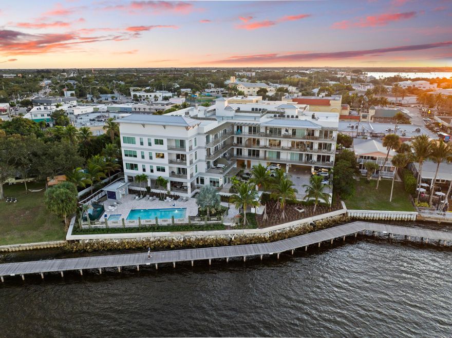 Come home to Sailfish Cove, where contemporary design meets premier waterfront living in award-winning downtown Stuart. One of the area's most coveted boutique luxury communities, Sailfish Cove is ideally located just steps from the Riverwalk, acclaimed dining, boutique shopping, galleries, vibrant entertainment, marinas, and weekend green markets & art strolls.  This one-of-a-kind, fully customized residence offers 2 bedrooms, 2 baths, a private 1-car garage, and thoughtfully designed living spaces that maximize both function and style. Enjoy breezy St. Lucie River views from your private patio, creating the perfect backdrop for relaxed coastal living.  No detail has been overlooked, with extensive custom finishes, built-ins, and added storage throughout. The completely reimagined kitchen and baths feature top-of-the-line finishes, including Sub-Zero refrigeration, custom cabinetry, and concealed laundry for seamless, elevated living.  Designer lighting, curated materials, and refined craftsmanship carry throughout the home.  The versatile second bedroom is enhanced with a built-in Murphy bed, allowing it to effortlessly transition between guest space and a sophisticated home office.  Sailfish Cove offers solid CBS construction, impact glass, secured entry, and exceptional amenities, including a resort-style pool with lap lane, waterfall, and sun loungers—all within an intimate, waterfront setting.  Known as the Sailfish Capital of the World, Stuart offers world-class boating and fishing, A-rated schools, a private airport, and convenient access to Palm Beach and the Bahamas.
