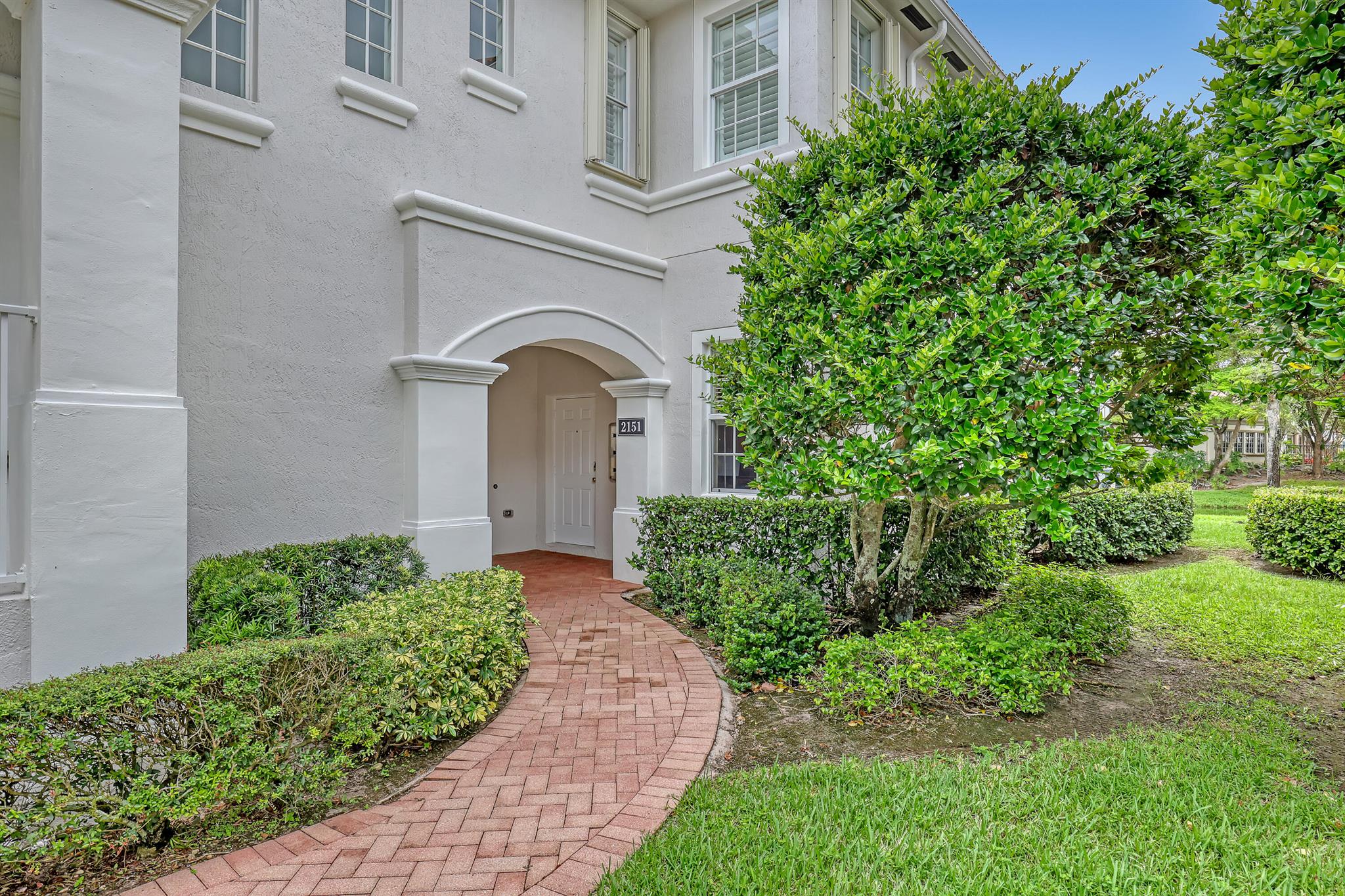 Nestled in the quaint community of Mayfair on Lake Wellington, this charming coach home is the perfect retreat--whether you're looking for year-round living or a seasonal getaway.The desirable Cocoa Beach floor plan offers true first-floor living with 3 spacious bedrooms and 2 full baths. The kitchen overlooks the tranquil waterway and features a breakfast nook and pantry. The primary suite boasts both a walk-in closet and a wall closet, while the en-suite bath includes dual sinks, a soaking tub, a separate shower, and a private water closet.Enjoy your morning coffee or take in magical sunsets from the comfort of your screened patio with lake views.Recent community improvements include new roofs and fresh exterior paint in 2025, giving you peace of mind for years to come.