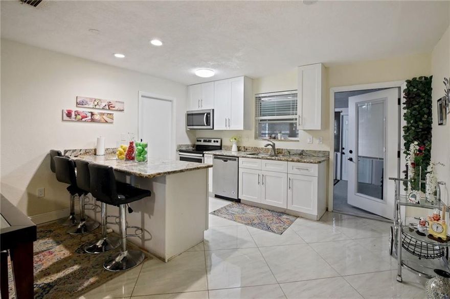Great locations!!Beautiful fully renovated 3 bed 2 bath Pool Home located in the heart of Hollywood close to everything. Screened Florida Room 1 car garage with large backyard and pool. Amazing Updated Kitchen with Wood Cabinets, Granite Counter Tops and Stainless-steel Appliances. Remodeled bathrooms, Brand New water heater, Ceiling Fans, Inside AC unit was just replaced. New Floors, Wooded Blinds throughout the Entire House. Hurricane Impacted Windows. Landscaping and Sprinkler System was put in 2019.