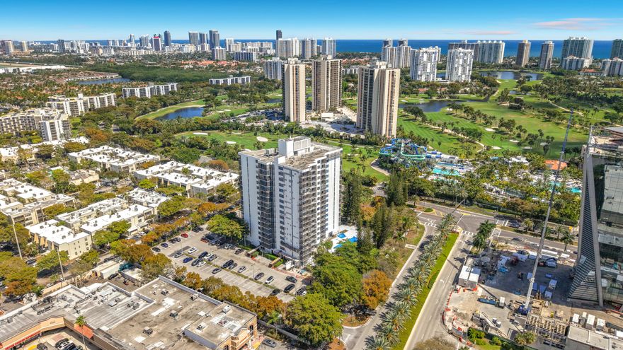 Spacious 7th floor unit w/ beautiful skyline, golf course, & water views in the heart of Aventura. This bright unit features an open layout, large living & dining areas, wood flooring throughout, & a large screened balcony perfect for relaxing. Generous primary suite includes updated bath, dual sinks, & walk in closet. Updated Kitchen w/ solid wood cabinetry, granite counters, and stainless appliances. Plenty of storage.  Community features on site management , pool, fitness area & recreation room. Ideally located near Aventura Mall, Turnberry Isle Golf Course, Gulfstream Park, beaches, dining, parks, and major highways including US-1 and I-95. Min to Brightline, hospitals, and Fort Lauderdale & Miami airports. Milestone inspection complete - assessment paid in full. No rentals 1st year.