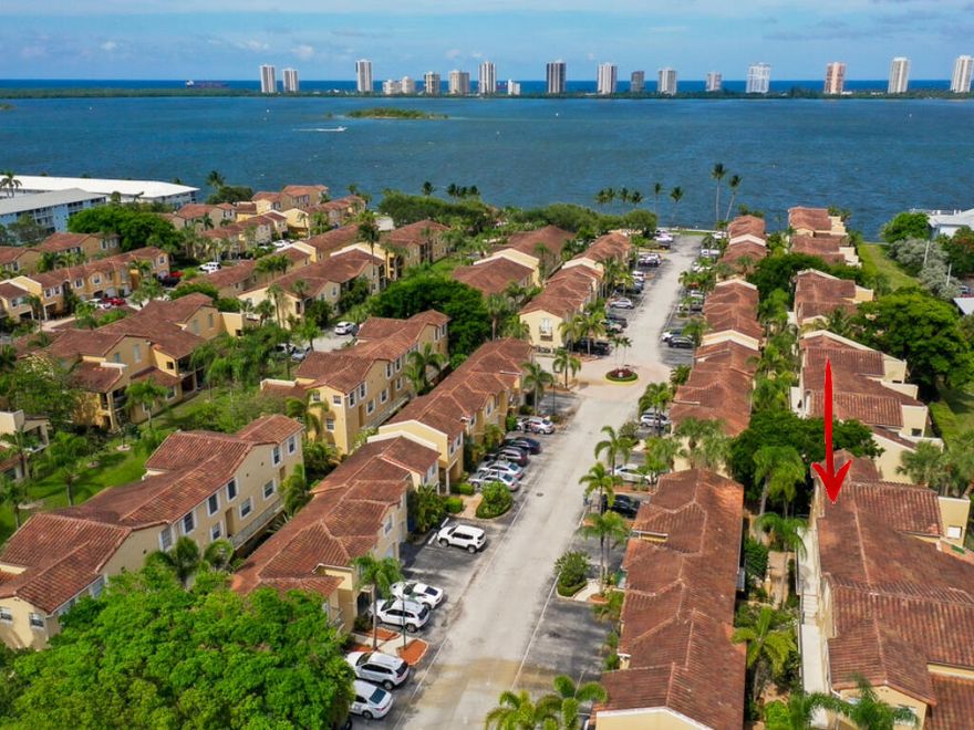 Experience luxury in waterfront Bay Reach, a gated community offering resort-style living. This immaculate second-floor condo features a 2 bedroom, 2 bathroom split floor plan. Optional garage and/or boat slop rental.  Hurricane impact windows.  The master suite, complete with a spacious walk-in closet and en-suite bath are on the second floor. The updated kitchen complements the open living space. Also, enjoy doing laundry in the comfort of your own home as it comes with a washer and dryer. Community's amenities include a resort style pool with breathtaking Intracoastal views, an exclusive private beach area, and picnic areas.

The clubhouse and fitness center, both provide a great view of the water. Schedule your showing today!