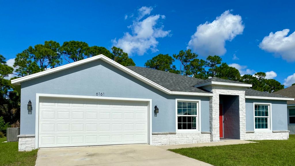 Photo of 6161 NW Gatun Drive, Port Saint Lucie, FL 34986 (MLS # R10939764)
