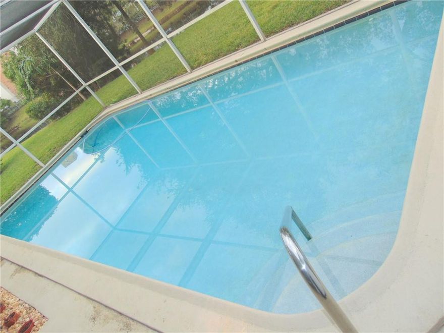 ~1/3 ACRE PIE SHAPED WATERFRONT LOT, SCREENED IN POOL. 13,932 SQUARE FOOT LOT. 126 FEET OF WATERFRONT. ROOM TO BUILD A BIG DETACHED GARAGE. VERY LARGE EAT IN KITCHEN, GAS STOVE. L-SHAPED LIVING ROOM DINING ROOM. STACKED BEDROOM FLOOR PLAN. BIG LOT ROOM FOR BUILDING AN EXTENSION ONTO HOUSE.  NO HOMEOWNERS ASSOCIATION. ROOF REPLACED 2018 INCLUDING PATIO ROOF. CITY GAS, UNDERGROUND ELECTRIC INSTALLED. ROOM FOR BOAT ON TRAILER & OR RECREATIONAL VEHICLE ON RIGHT SIDE OF HOUSE (11.7 foot minimum side yard, see survey) NEW CIRCUIT BREAKER PANEL & GFCI OUTLETS INSTALLED. FRESHLY PAINTED. BRAND NEW CARPET INSTALLED ON OCT 27 2021, NEW DOOR KNOBS, TEXTURED CEILINGS (No Popcorn) NEW SLIDING GLASS DOOR LOCKS & HANDLES. CLEAN & MOVE IN READY. CALL ME NOW & SEE YOU WILL BE GLAD YOU DID