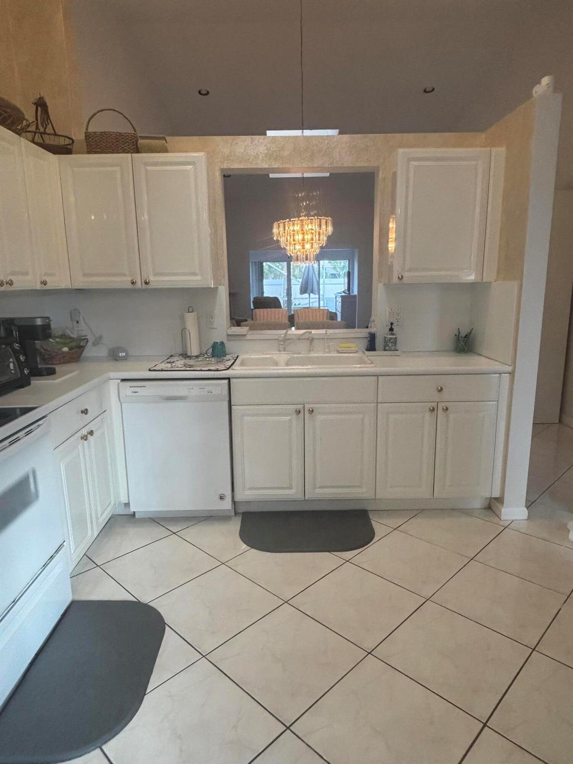 Experience comfort and style in this delightful seasonal rental, nestled within the vibrant 55+ community of Coral Lakes. This fully furnished home boasts a modernized kitchen and sleek ceramic tile flooring throughout the living spaces. Both bathrooms have been beautifully renovated, featuring elegant fixtures and contemporary touches--including Toto washlet toilets with heated seats and built-in bidets. Skylights throughout the home fill the space with natural light, enhancing the open and welcoming ambiance. Step out onto the private screened patio, perfect for savoring your morning coffee or unwinding in the evening breeze. Set in a lively and active community, this home provides the perfect balance of social connection, fitness opportunities, and serene relaxation.