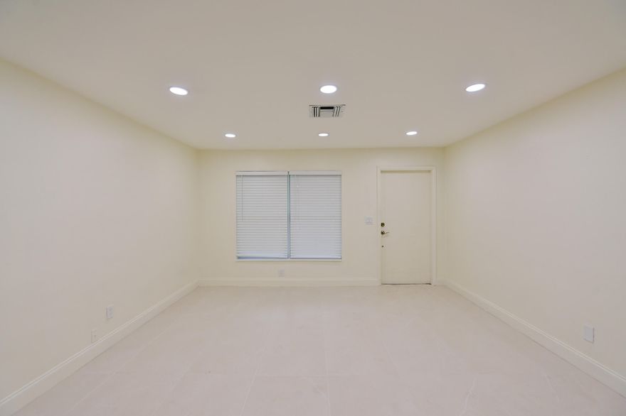 Fully renovated 3 Bedroom / 2 Bathroom + Den single-family home. Move-in ready with brand-new modern kitchen featuring quartz countertops, stainless steel appliances, and 24x48 porcelain tile flooring throughout. Freshly painted interior, updated bathrooms, and new central A/C. Impact windows for safety and energy efficiency. Spacious fully fenced backyard, perfect for outdoor living. Great location near shopping, dining, and major roads. No HOA. Available for immediate occupancy.