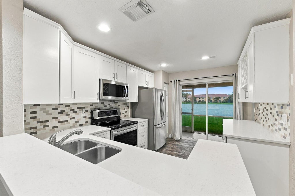 Photo of 6215 EATON Street, West Palm Beach, FL 33411 (MLS # B26077952)