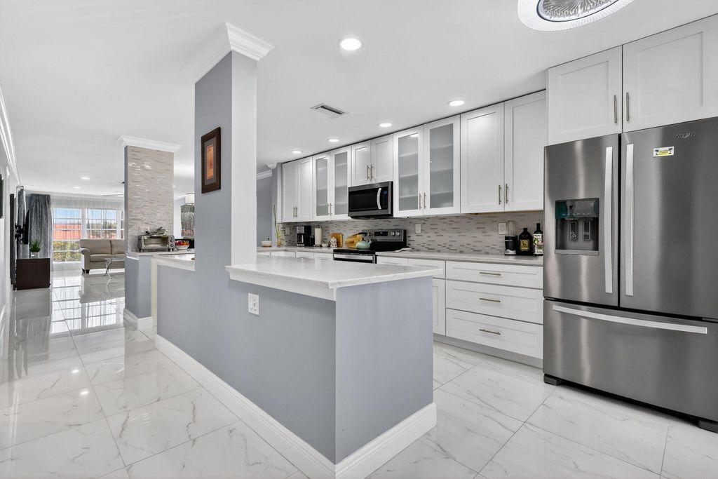 Photo of 5675 Queen Palm Ct #E, Delray Beach, FL 33484 (MLS # R11166186)