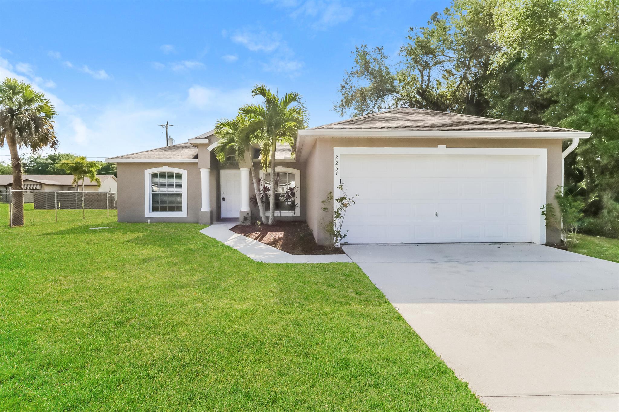 Discover this 3-bedroom, 2-bathroom pet-friendly home offering 1,432 sq ft of space. The kitchen is equipped with stainless steel appliances, including a refrigerator, microwave, range oven, and dishwasher. Enjoy a ceiling fan and window coverings for added comfort. The exterior boasts a fenced yard and an attached garage for convenience. The bathroom features a bathtub, perfect for relaxation.