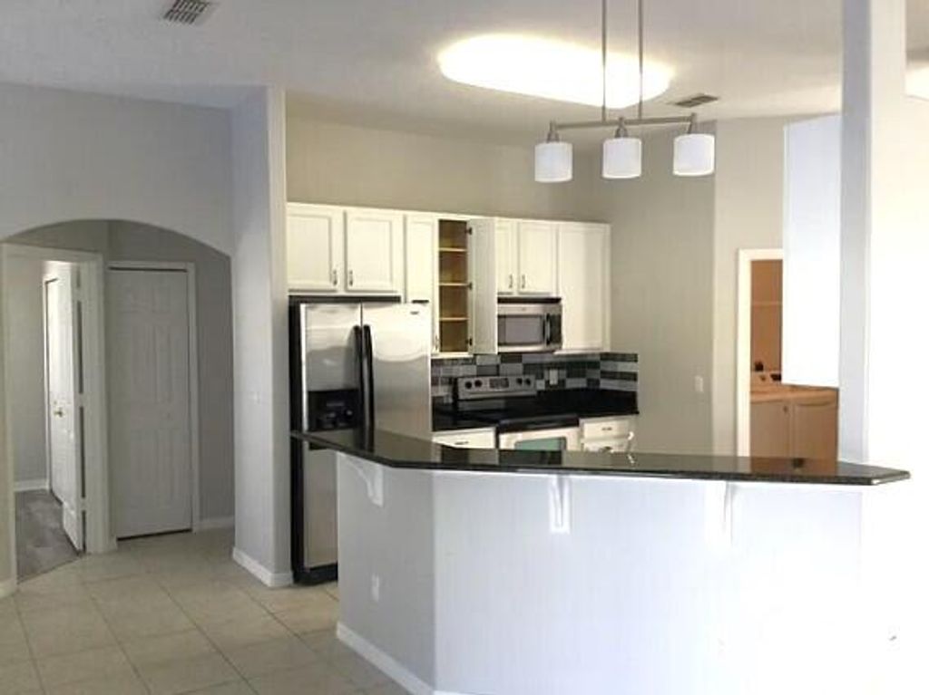 Photo of 2367 SE Rock Springs Drive, Port Saint Lucie, FL 34952 (MLS # B26003672)