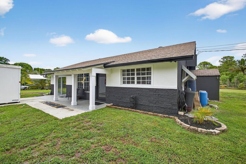 Photo of 11447 52nd Road N, The Acreage, FL 33411 (MLS # R11105075)