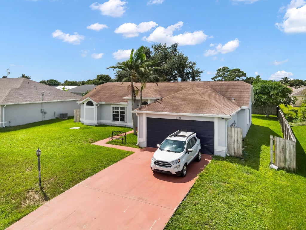 Photo of 1426 SW Dow Lane, Port Saint Lucie, FL 34953 (MLS # R11018289)