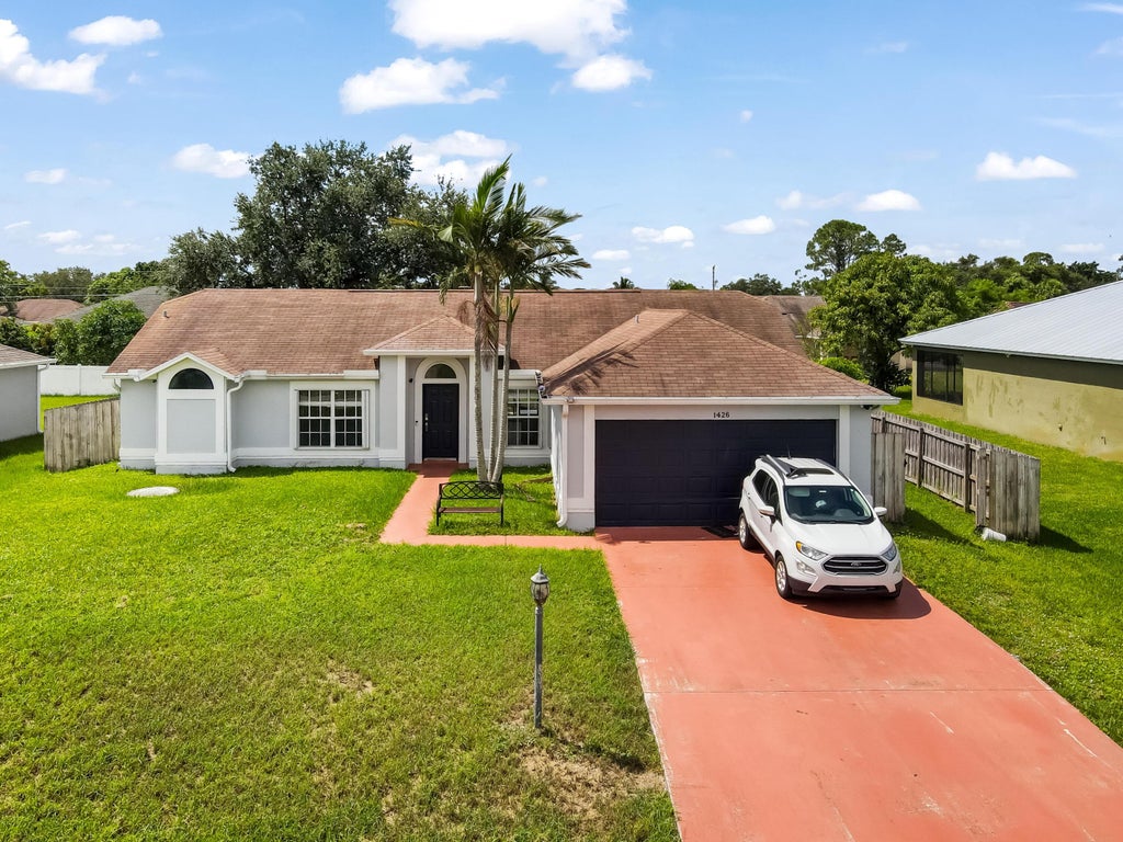 Photo of 1426 SW Dow Lane, Port Saint Lucie, FL 34953 (MLS # R11018289)
