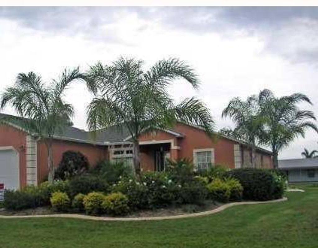 Photo of 1049 SW Coleman Avenue, Port Saint Lucie, FL 34953 (MLS # R10755661)