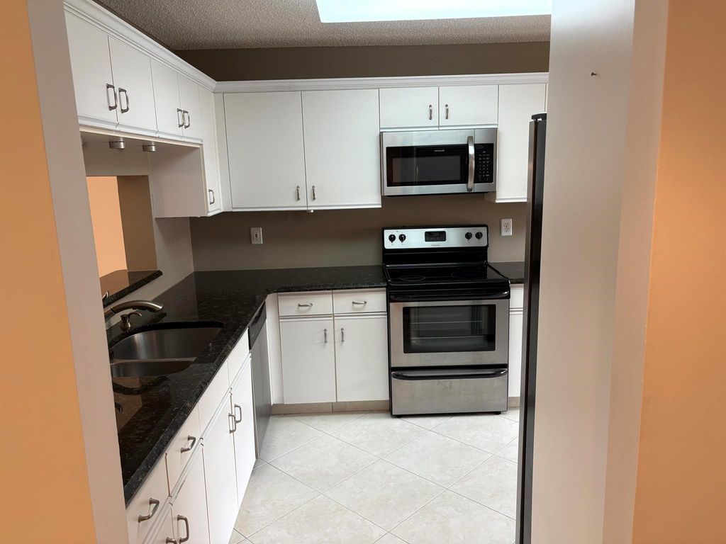 Photo of 4725 Lucerne Lakes Boulevard #210, Lake Worth, FL 33467 (MLS # R11103744)