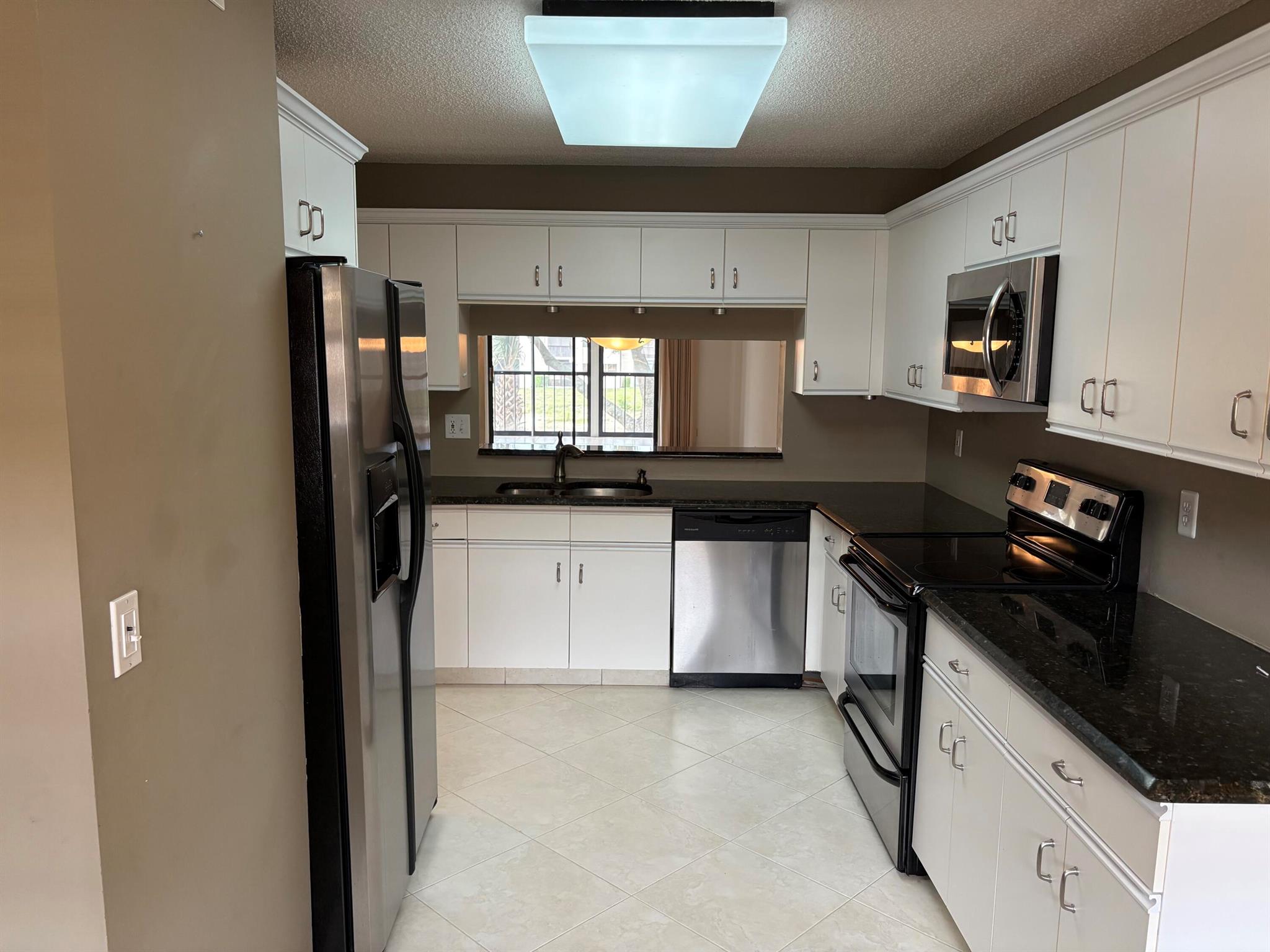 BEAUTIFULLY UPDATED KITCHEN WITH STAINLESS STEEL APPLIANCES. RECENTLY PAINTED FOYER AND LIVING/DINING ROOM. THIS UNIT HAS A LARGE WALK IN LAUNDRY ROOM WITH FULL SIZE WASHER,DRYER,SHELVING,&CLOSET. FULL SIZE WASHER,DRYER,SHELVING,&CLOSET. CEILING FANS IN KITCHEN, MASTER BEDROOM,GUEST RM & TILED PATIO, AND A SPECTACULAR VIEW OF THE CANAL. LUCERNE IS AN ACTIVE ADULT COMMUNITY WITH A BEAUTIFUL CLUBHOUSE, THREE POOLS AND, COMMUNITY BUS SERVICE 3 TIMES A WEEK. 55 PLUS COMMUNITY.