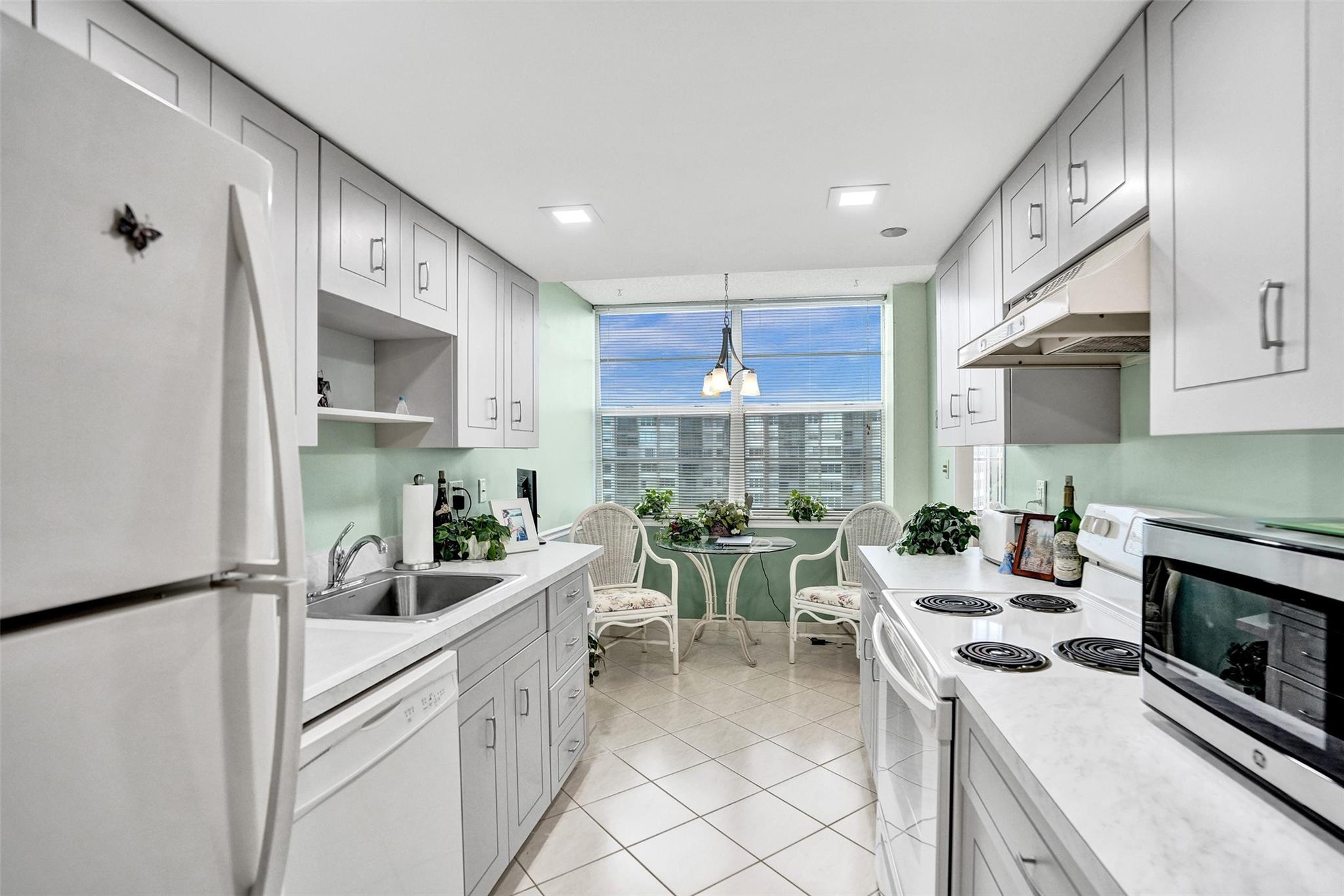 Bright and spacious CORNER unit in the desirable 55+ community of Park Place! This well-maintained 2 bed/2 bath is the only model with a charming sunlit breakfast nook, complementing the gallery-style kitchen. The spacious primary suite features an oversized walk-in closet while the screened balcony offers tranquil views of the new park and tennis courts. Enjoy the convenience of same-floor laundry and storage. Resort-style amenities include 24/7 gated security, heated pools, fitness center, tennis, walking/bike paths, social rooms, library, and a courtesy bus, all surrounded by a lush golf course. Maintenance covers water, basic cable & internet. Centrally located near shopping, dining, hospitals & more!