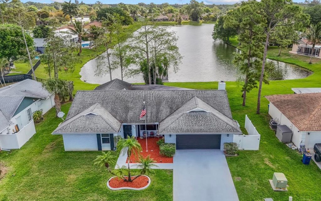 Photo of 125 Parkwood Drive, Royal Palm Beach, FL 33411 (MLS # B26010075)