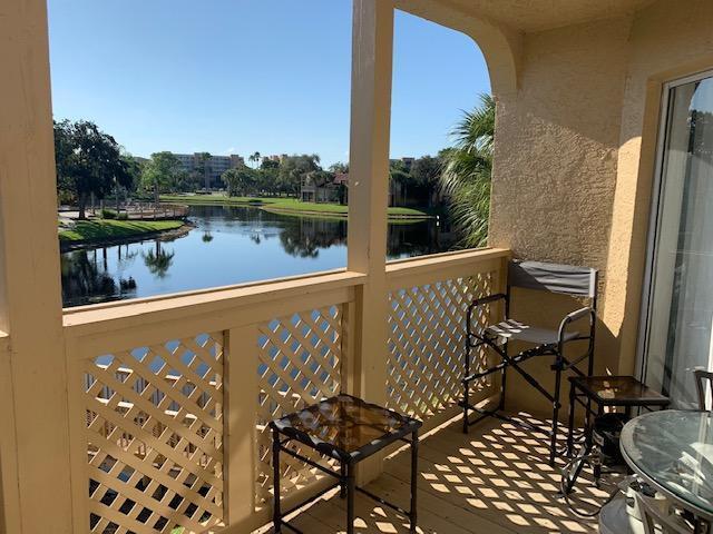 1/1 second floor unit with stunning lake views! Brand new wood look laminate flooring! Bright and open floor plan with high ceilings and spacious balcony. Unit offers ample storage and in unit washer/dryer. Palm Lake is a gated community in central West Beach. Amenities include community pool, tennis, and clubhouse.