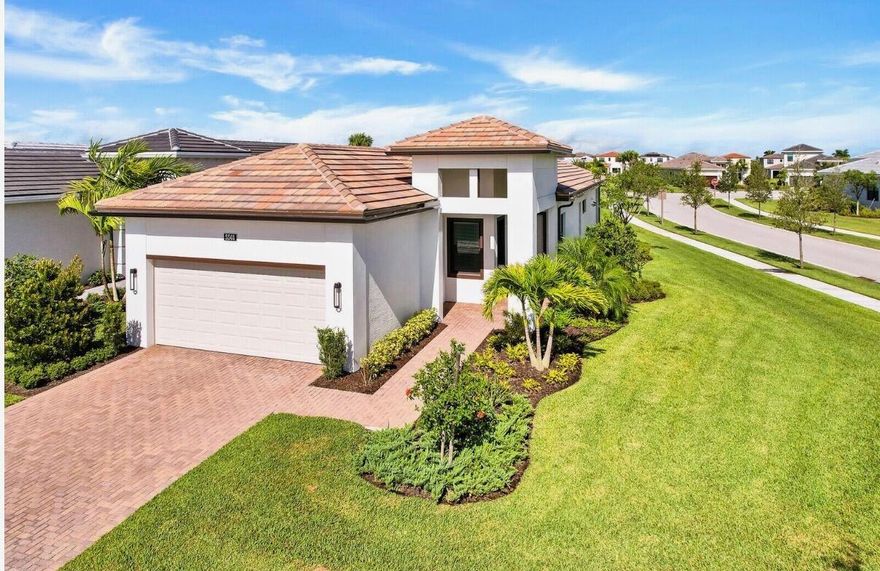 This luxurious 3-bedroom, 2-bathroom home in Cresswind at Westlake features an open floor plan and a kitchen perfect for cooking and entertaining, with white cabinetry, quartz countertops, and stainless steel appliances. This home also features impact glass, a covered patio, and a garden view, adding protection and outdoor enjoyment. Located in the vibrant Westlake community, residents enjoy resort-style amenities including pools, a fitness center, clubhouse, sports courts, playgrounds, and more. This home offers a fun, easygoing lifestyle in one of South Florida's most exciting communities, complete with countless amenities! ACTIVE ADULT COMMUNITY.