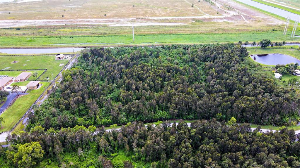 5 acre lot in Gated Equestrian Community of Deer Run. UNINCORPORATED. Easy entrance into the lot with large vehicles and horse trailers! Build your dream Home surrounded by nature. Over 20 miles of horse trails. Property is high and dry with excellent drainage. This is a perfect property for real estate investors, developers or equestrian lovers. 11.9 miles from the WEF 2.3 miles from the White Fence Equestrian Center, 15.1 miles from the International Polo Club. 9.3 miles from the Palms West Hospital 7 miles from Publix, Tractor Supply, Palm Beach College, Urgent Care, 7 Eleven Gas Station, Loxahatchee Groves Commons Plaza, restaurants and much more.