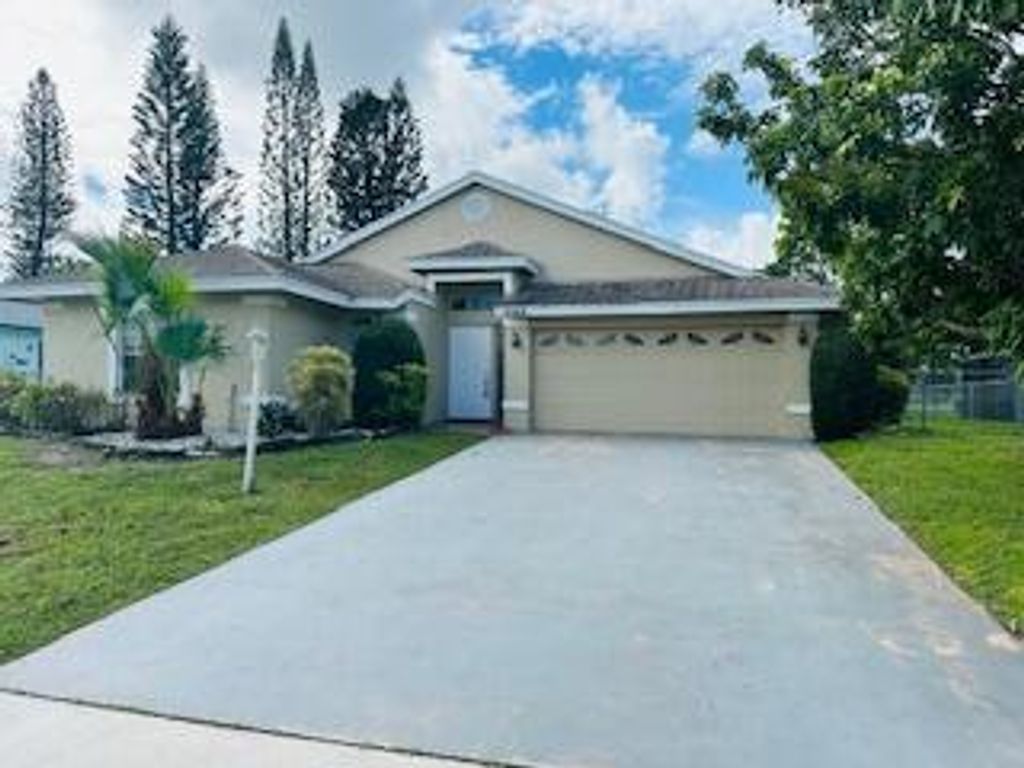 Photo of 2549 Canterbury Drive N, Riviera Beach, FL 33407 (MLS # R11126704)