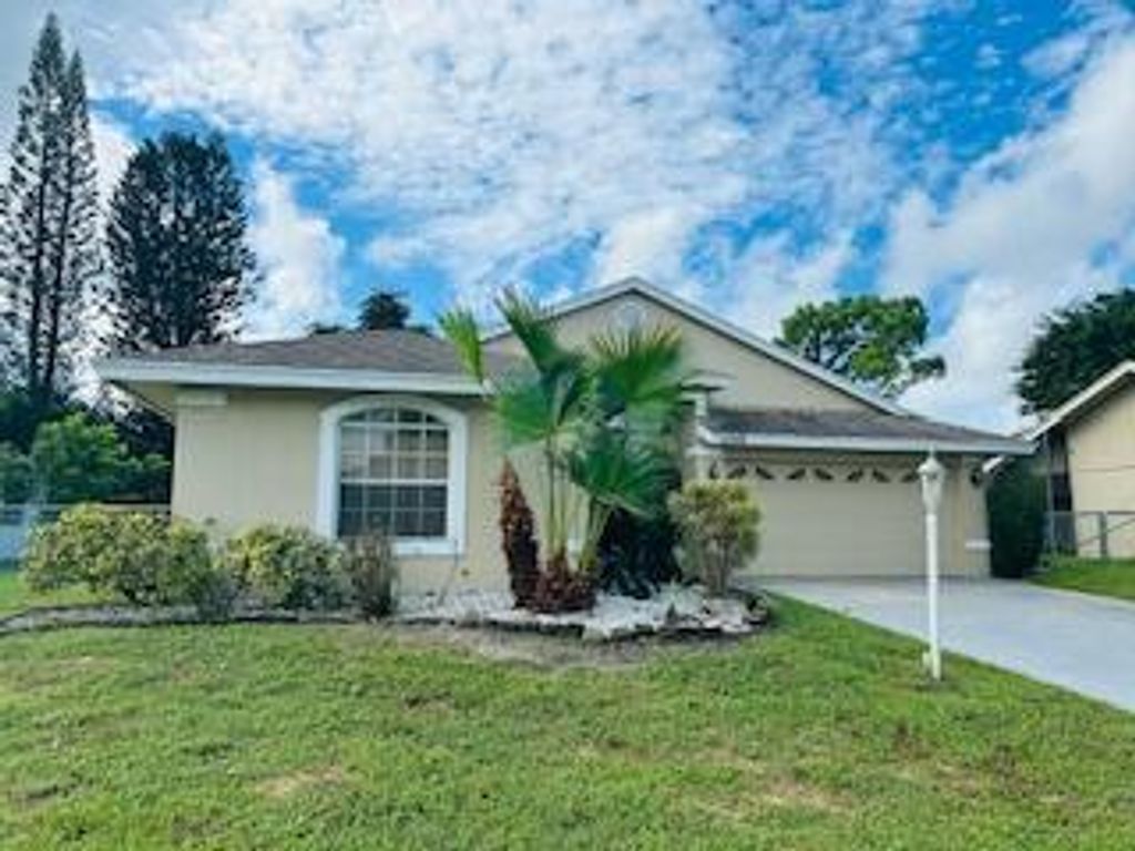Photo of 2549 Canterbury Drive N, Riviera Beach, FL 33407 (MLS # R11126704)