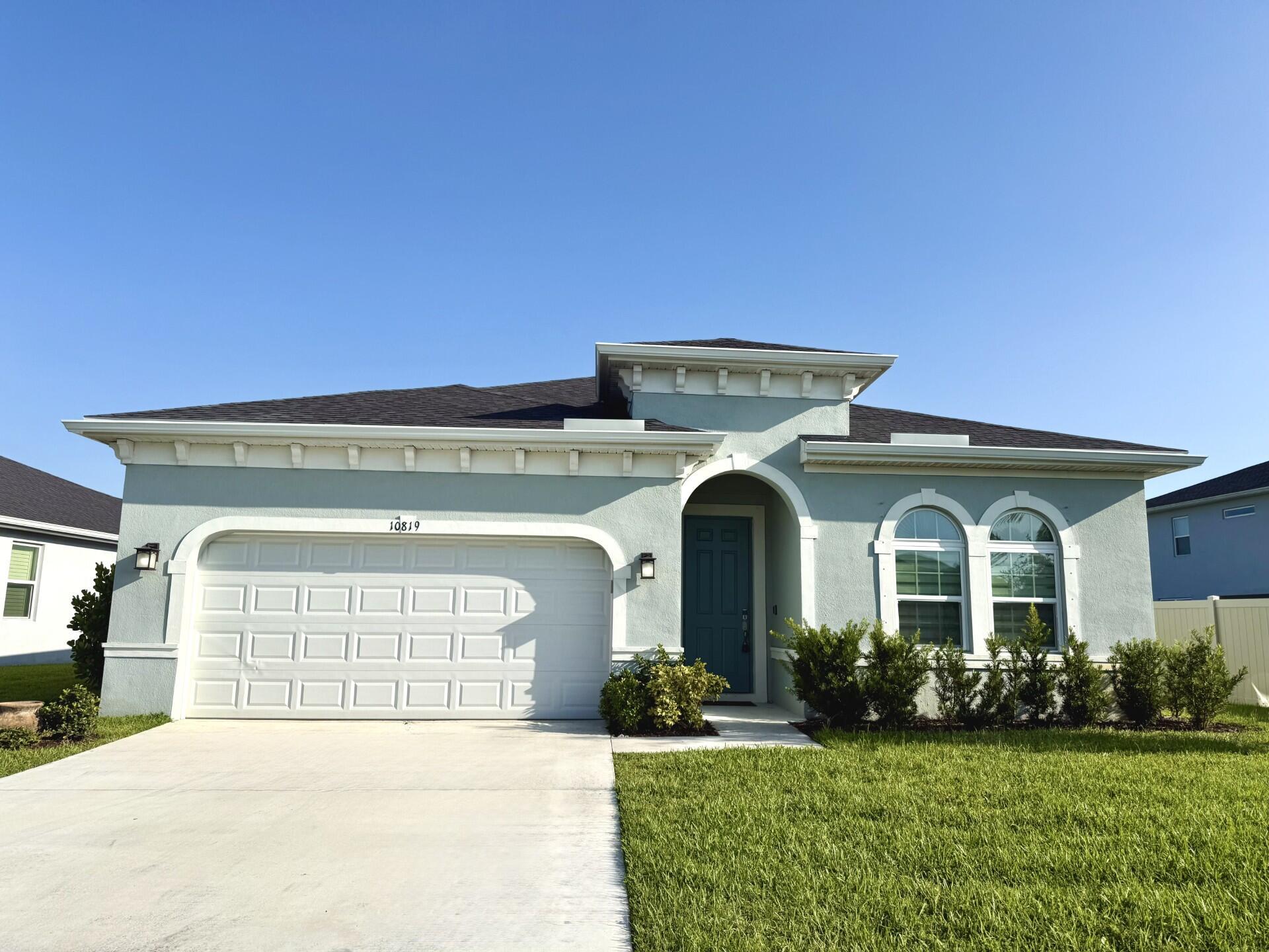 Welcome to Crosstown Commons!This vibrant, family-friendly community is ideally located just minutes from the Tradition area, close to top-rated schools, shopping, and dining. Community amenities include a sparkling pool and a playground. Residents love the laid-back HOA atmosphere and the strong sense of community complete with a dedicated social committee that plans events/activities for all ages.This beautiful home offers 4 bedrooms, 2 bathrooms, and a 2-car garage. The backyard is fully fenced with an extended patio overlooking a lake that has perfect sunset views.Inside, the kitchen is a showstopper, featuring top-of-the-line appliances, an oversized island, and sleek modern lighting.