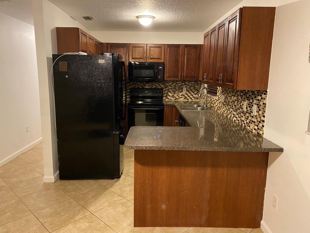 Photo of 4119 Ponza Pl, Lake Worth, FL 33462 (MLS # F10391520)
