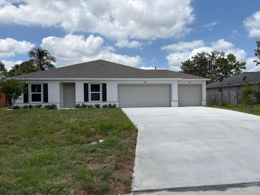 Photo of 1054 SE Euclid Lane, Port Saint Lucie, FL 34983 (MLS # R11085757)