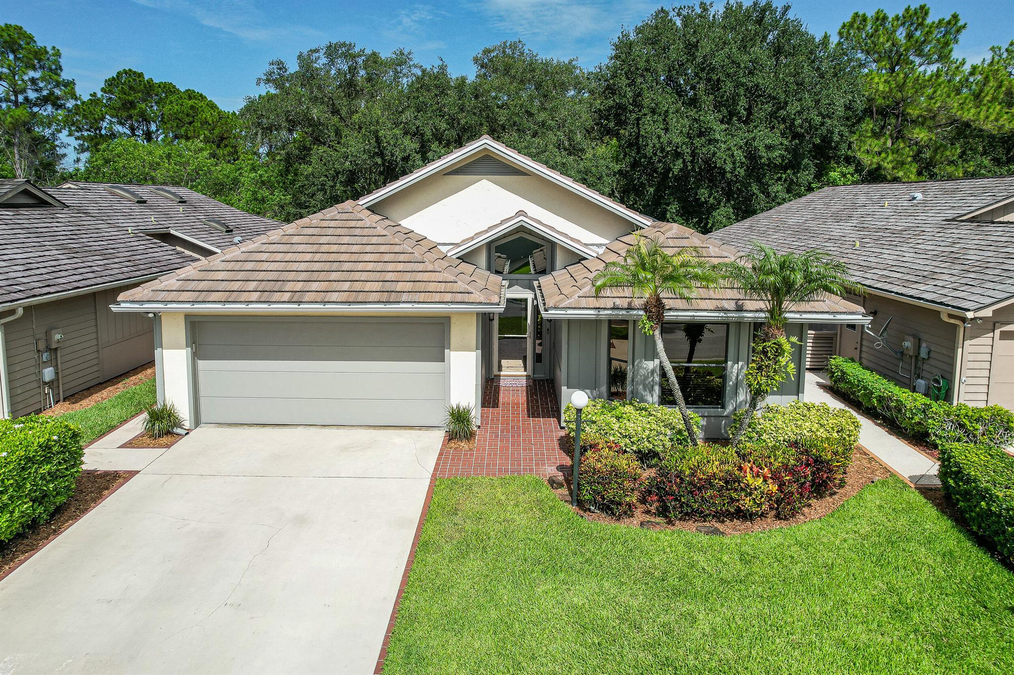 Tucked away in the sought-after Mallard Creek at Martin Downs, this immaculate home offers comfort, style, and privacy. Featuring high ceilings, an updated kitchen, newer A/C, and a 2022 roof, it's move-in ready and beautifully maintained. Enjoy the screened-in patio, perfect for entertaining or relax in the quiet, private backyard. Ideally located near I-95, the Turnpike, top-rated schools, and shopping. Golf membership is optional. HOA includes gated security, lawn care, irrigation, cable, internet & maintenance of common areas.